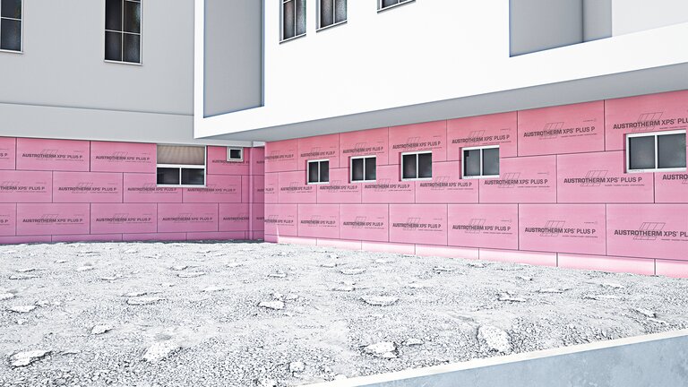 Außenseite eines Gebäudes mit rosa Dämmplatten "Austrotherm XPS PLUS P" aus extrudiertem Polystyrolhartschaum mit geprägter Oberfläche.