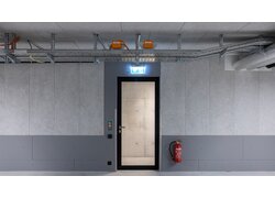 UNITEX L-EPS in einer Tiefgarage an Wand und Decke. Mittig ist ein Notausgang abgebildet