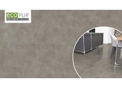 Grauer Betonboden in moderner Wohnküche.