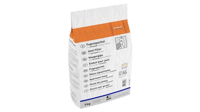 Spachtel, Putz Mörtel, verpackt in weißes Papier