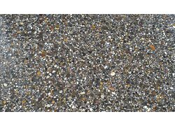 Nahaufnahme eines Lafina Terrazzo, dunkel mit hell bepunktetem Muster