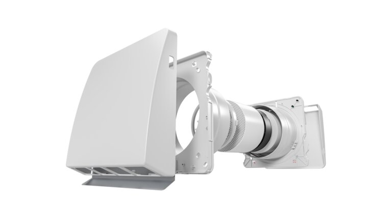 Das Bild zeigt eine technische 3D-Zeichnung eines Leaf Basic Lüftungsgeräts in Explosionsansicht. Die Komponenten sind von links nach rechts angeordnet: eine Außenabdeckung, Ventilatoreinheit, Filterelemente, keramischer Wärmetauscher und das Anschlussgehäuse für die Wandmontage. Die Darstellung verdeutlicht den inneren Aufbau und die Funktionsweise des Systems für dezentrale Wohnraumlüftung mit Wärmerückgewinnung. Das Modell ist in Grautönen gehalten, der Hintergrund ist weiß.