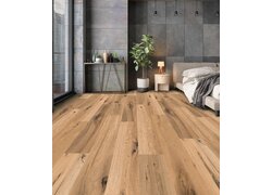 Modernes Schlafzimmer mit Holzfußboden und Pflanze.